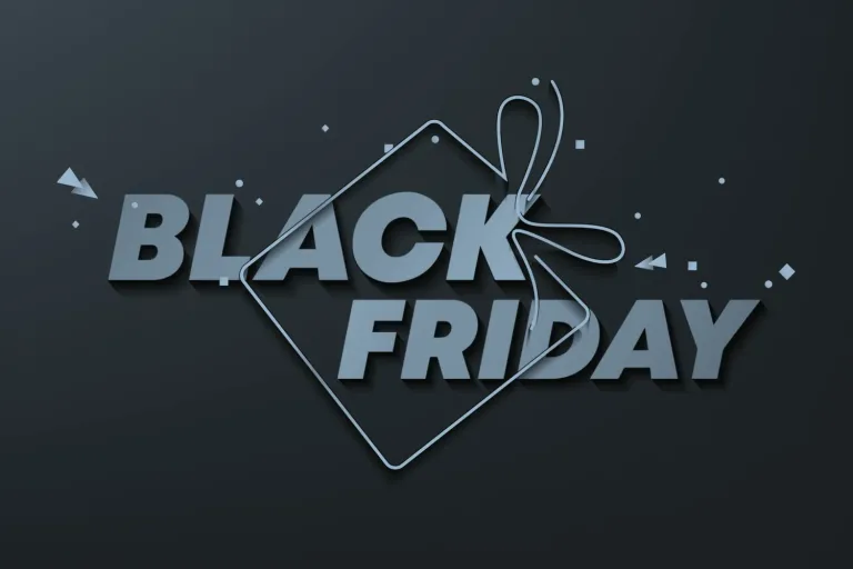 Black Friday in bold type on a dark background, with a gift tag and ribbon outline